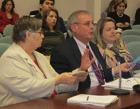 MSDE's Chuck Buckler (center), along with Assistant State Superintendent Ann Chafin and Sally Dornan, explains the changes to the emergency guide.