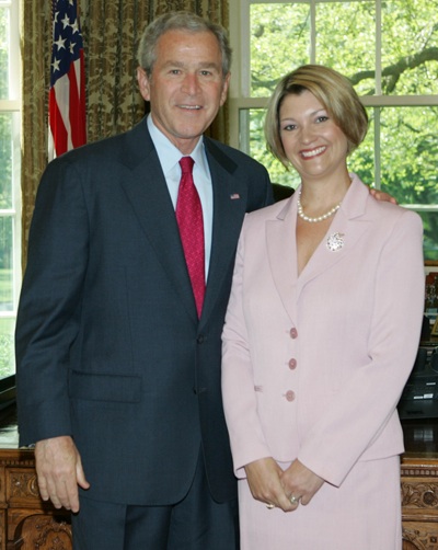 President George W. Bush congratulates Maryland’s 2008 State Teacher of the Year, April Todd, in the Oval Office on Wednesday, April 30, 2008.