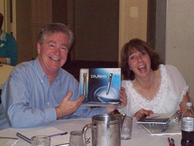 Dan Davis from TOY from Talbot County and Donna McCallister from Anne Arundel County shows off pen from Livescribe.
