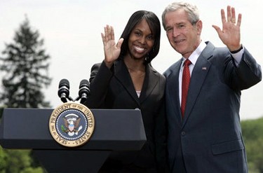 President George W. Bush and Kim Oliver, the 2006 National Teacher of the Year, wave